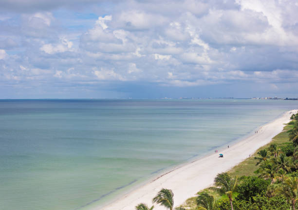 Midday scene at Naples beach, Florida Midday scene at Naples beach, Florida naples beach stock pictures, royalty-free photos & images