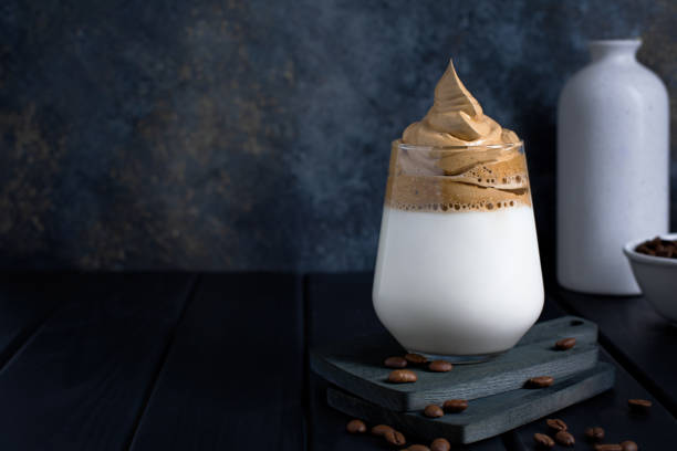 istock Dalgona coffee in a transparent glass on a dark background. 1337170824
