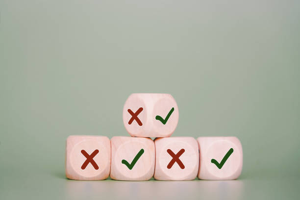 istock wood cube showing two sides, true and false sign on the others with green background and copy space, in soft focus for business, make a decision concept 1337172788