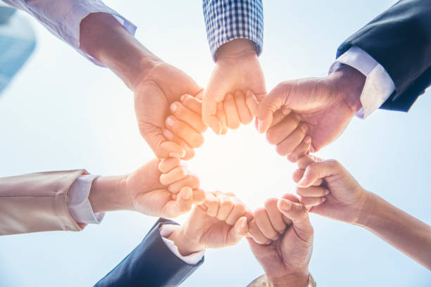 istock Diverse multiethnic Partners hands together teamwork group of multi racial people meeting join hands togetherness. Diversity people hands join empower partnership teams connection volunteer community 1337173438