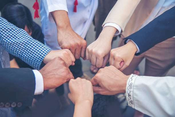 istock Diverse multiethnic Partners hands together teamwork group of multi racial people meeting join hands togetherness. Diversity people hands join empower partnership teams connection volunteer community 1337173439