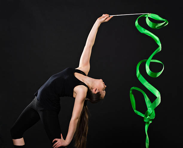 istock beautiful gymnast with green ribbon 133717388