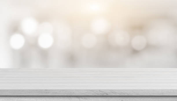 istock White wood table top over blur bokeh light background. 1337175561