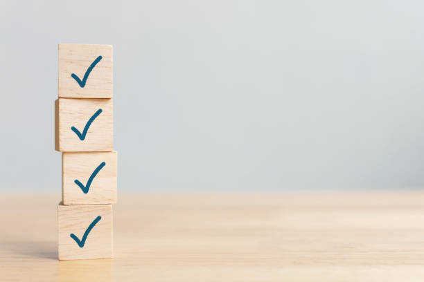 checklist concept, check mark on wooden blocks on table with copy space - inventário imagens e fotografias de stock