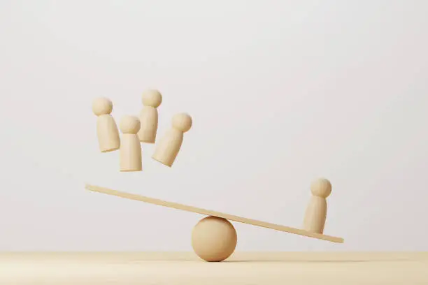 Wooden human compared balancing on wood scale seesaw. 3d illustration
