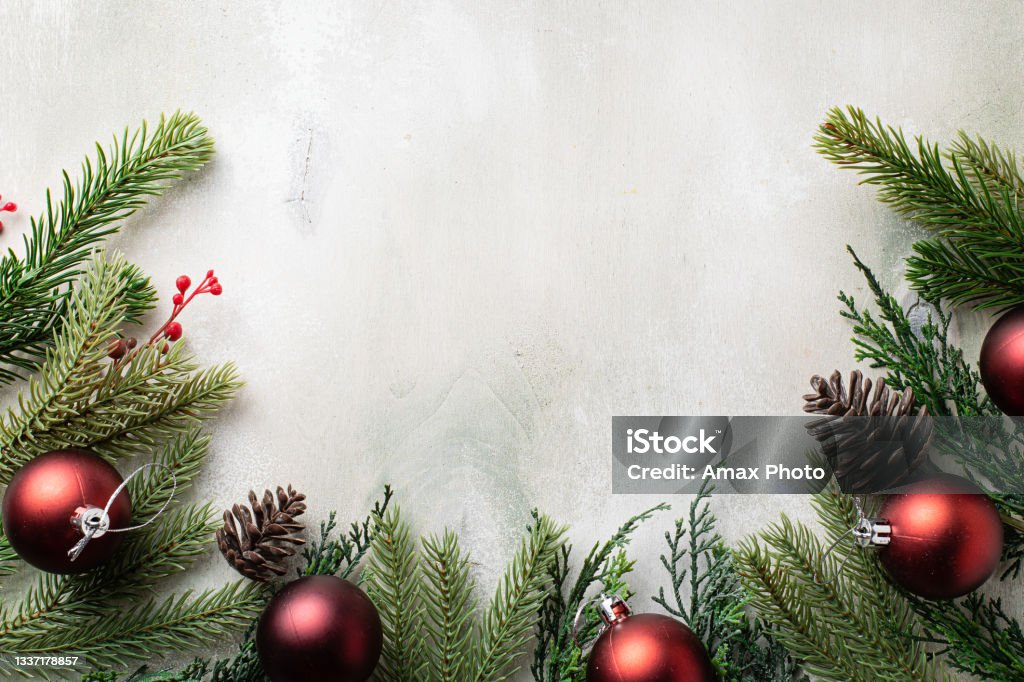 Christmas frame with fir tree branches on light wooden background Christmas Stock Photo