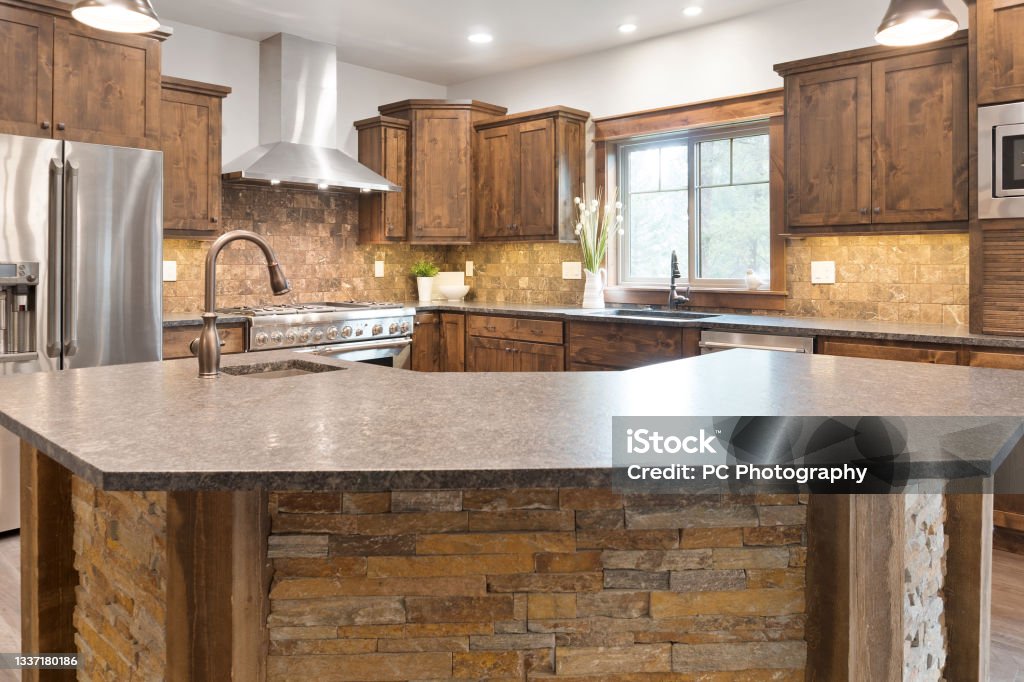 New kitchen with new appliances Brown wood cabinets Kitchen Stock Photo