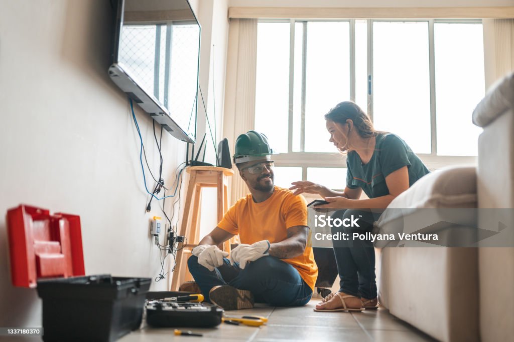 Electrician working home client Man, Electrician, Repairman, Manual work, Service Electrician Stock Photo