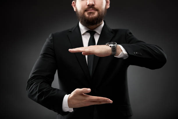 Man in suit gesturing vertical size with hands stock photo