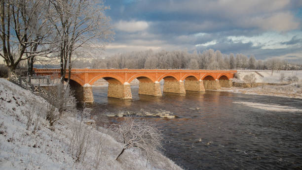 istock Long brick bridge over Venta river in winter day, Kuldiga, Latvia 1337182763
