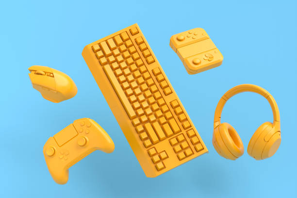 istock Flying gamer gears like mouse, keyboard, joystick, headset on blue and yellow 1337190482