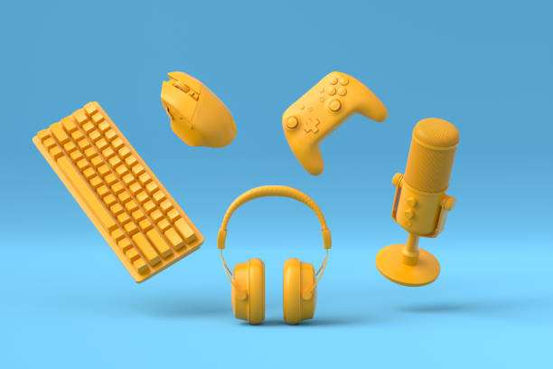 istock Flying gamer gears like mouse, keyboard, joystick, headset on blue and yellow 1337190565