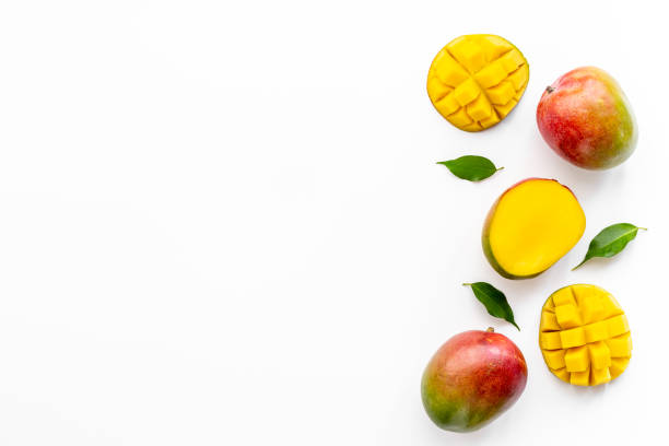 Layout of mango and leaves. Tropical fruits background stock photo