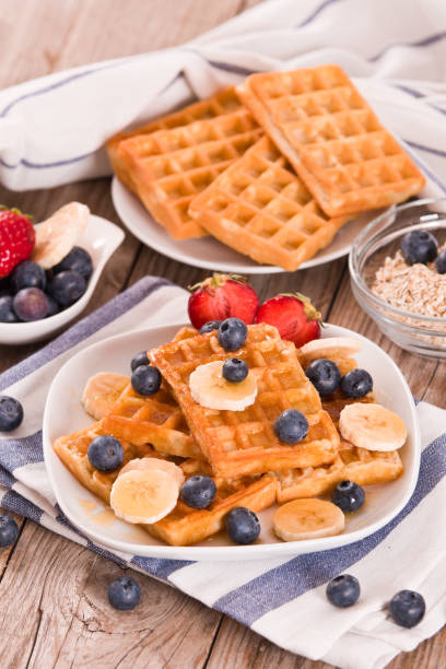 istock Waffles with blueberries, bananas and honey. 1337191579