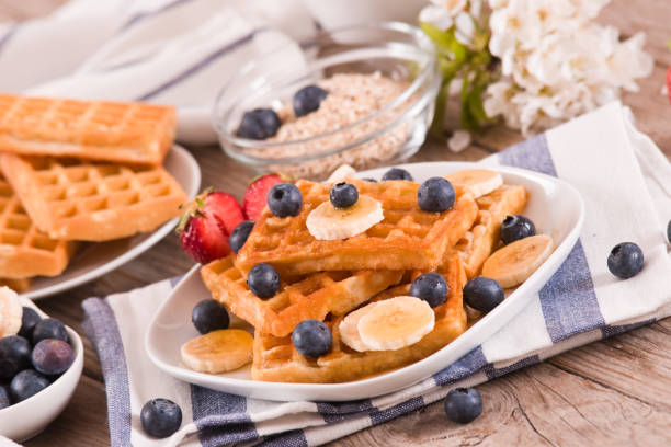 istock Waffles with blueberries, bananas and honey. 1337192992