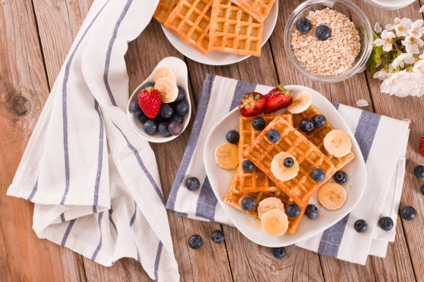 istock Waffles with blueberries, bananas and honey. 1337193041