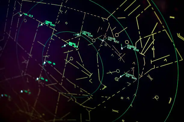 A view of an air traffic controller's screen. Shallow depth of field.