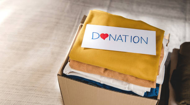 istock Clothes Donation Concept. Box of Cloth with Donate label. 1337193884