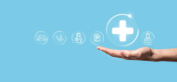 istock Businessman hold virtual plus medical network connection icons. Covid-19 pandemic develop people awareness and spread attention on their healthcare.Doctor,document,medicine,ambulance,patient icon. 1337193916