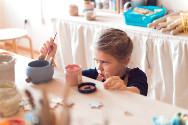 istock girl modeling clay 1337195495