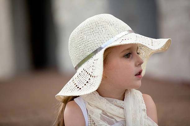 Portrait of little girl in sunhat stock photo