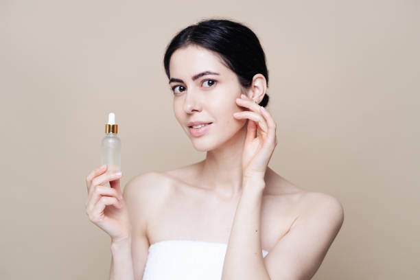 istock Caucasian woman holding bottle with serum 1337199636