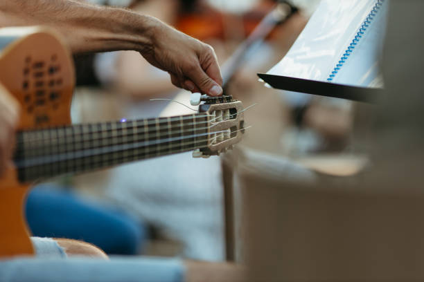 istock Close-Up Of Person Playing Guitar 1337200233