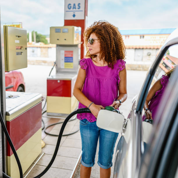 istock Young woman refuel the car 1337203873