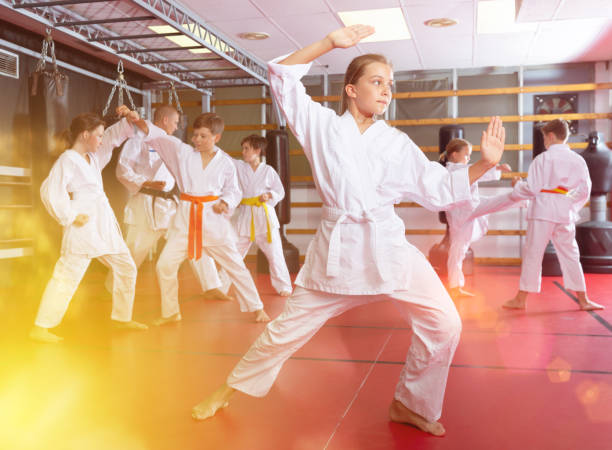 istock Girl in kimono posing in gym 1337204037