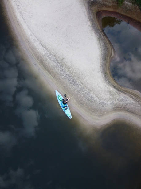 istock surfer with a paddle on the river from above 1337204123