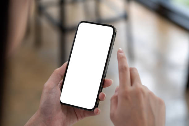 istock Image of woman using a smartphone blank white screen at the office. 1337204173