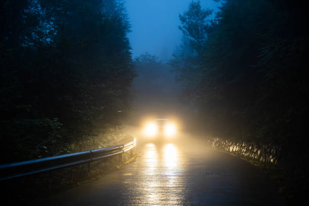 Car driving in fogy night