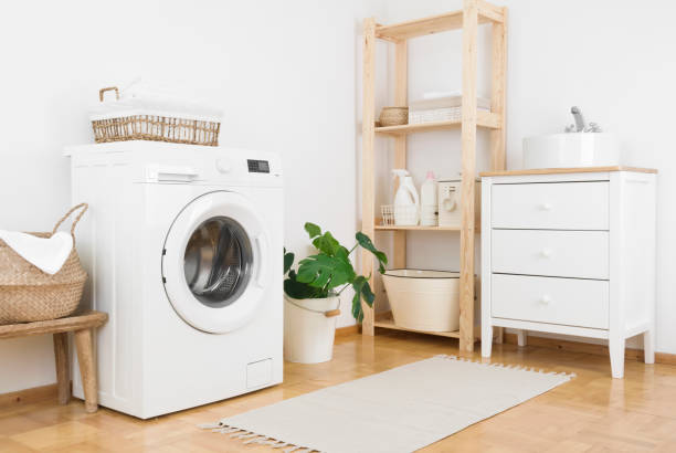 istock Bathroom laundry corner interior with washing machine, storage and sink 1337205521