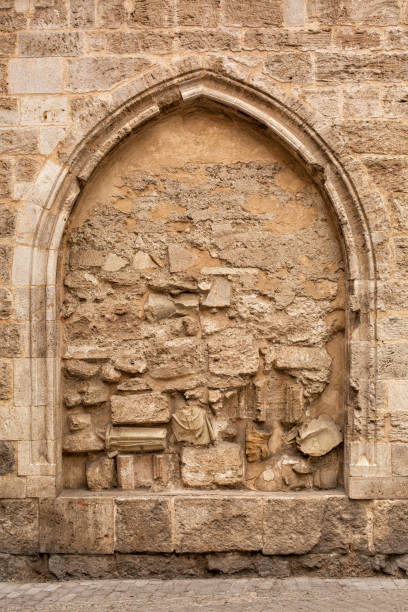 Medieval stone arch false fake window. Frame background, copy space. Medieval stone arch false fake window. Frame background, copy space. turret arch stock pictures, royalty-free photos & images