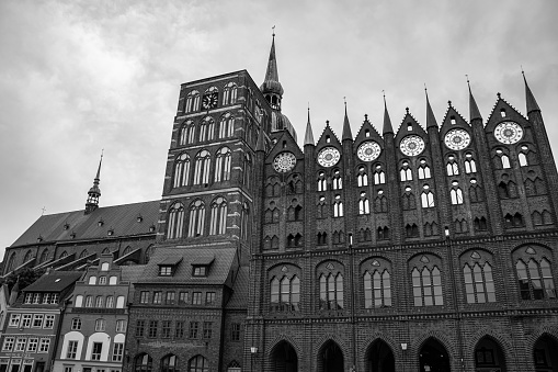 Black and white photo of the famous town hall of Stralsund with the St. Nikolai church, Germany
