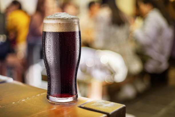 istock Beer glass isolated on a white background. Contains clipping path. Brown beer. 1337209068