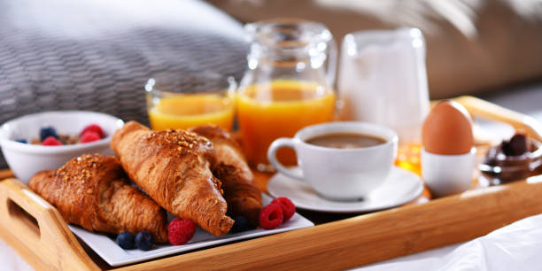istock A tray with breakfast on a bed in a hotel room 1337209488