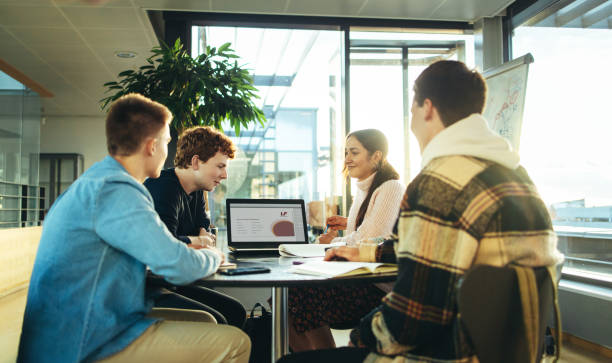 istock Group of students working on college presentation 1337210210