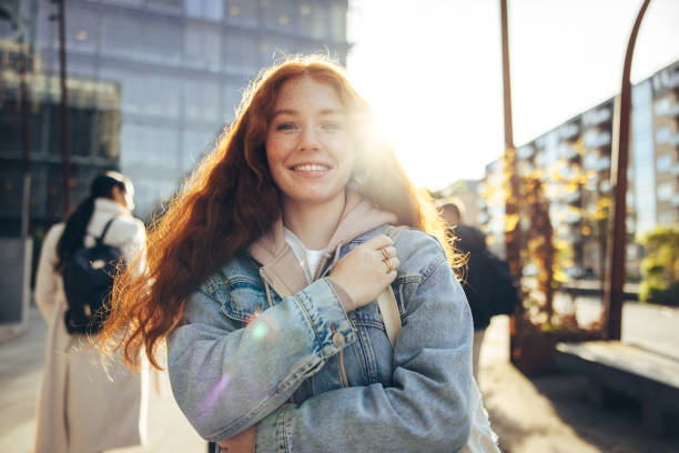 istock Beautiful girl standing in college campus 1337210276