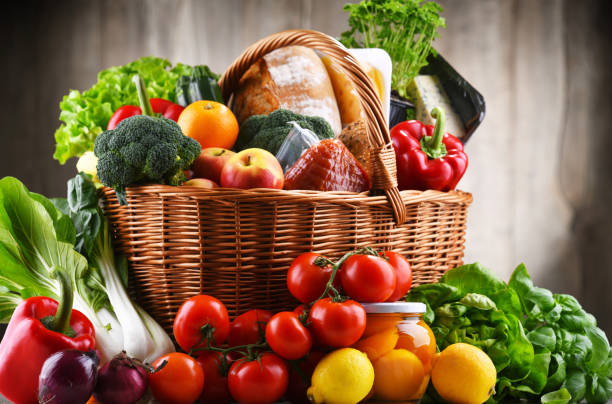 istock Wicker basket with assorted grocery products 1337210686