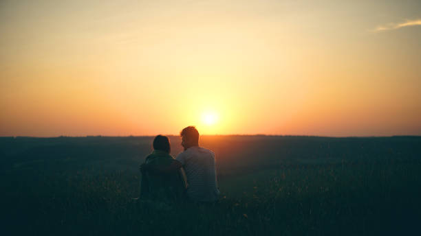 istock The romantic couple watching the beautiful sunset view 1337211954