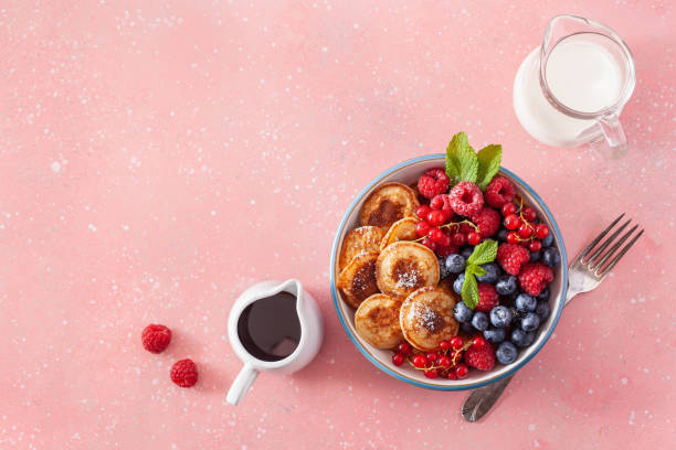 istock mini pancake breakfast bowl with berries and maple syrup 1337213165