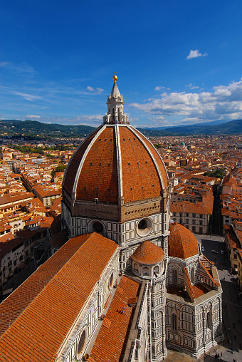 Aerial view of wonderful dome of Santa Maria del Fiore (St Mary of the Flower) and the city of Florence characteristic red tiles. Built by italian architect Brunelleschi in the 15th century, a symbol of Renaissance art adn architecture in the world
