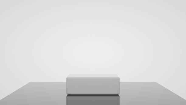 istock 3D white square podium for packaging presentation. Product display with white plastic textures, glassy floor and white background. 3d illustration 1337214395