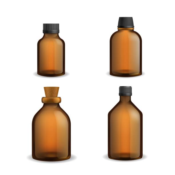 istock Bottles glass medical. Realistic brown blank transparent packaging with plastic cap, pharmacy syrup bottle 3d. Aromatherapy essential oil and cosmetic flasks different sizes vector set 1337214475