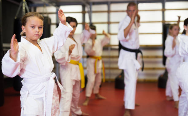 istock Young boys and girls in kimono doing kata 1337214547