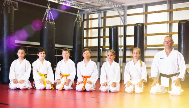 istock Group of karate kids and their trainer 1337214559