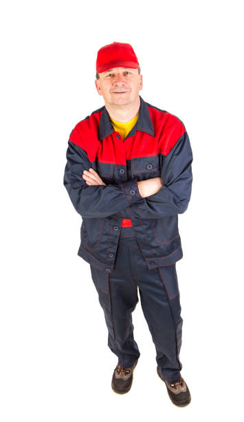 istock Smiling worker in overalls looks at the camera. 1337216095