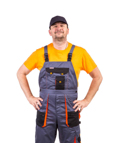 istock Smiling worker in overalls looks at the camera. 1337216142