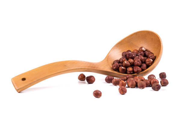 istock Wooden ladle with hazelnuts. 1337216219